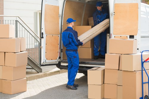 Professional man and van handling furniture in Ickenham