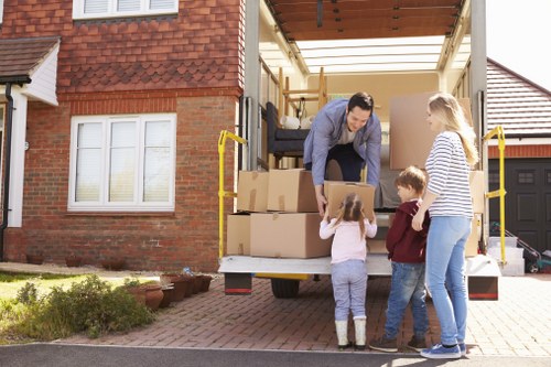 Professional movers loading furniture into a removal van