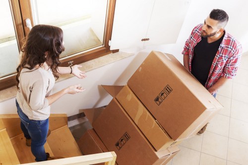 Professional movers protecting furniture during an Ickenham relocation