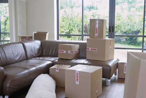 Student removals team handling boxes and furniture in Ickenham