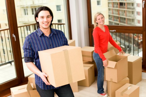 Staff using safe lifting techniques during a moving job
